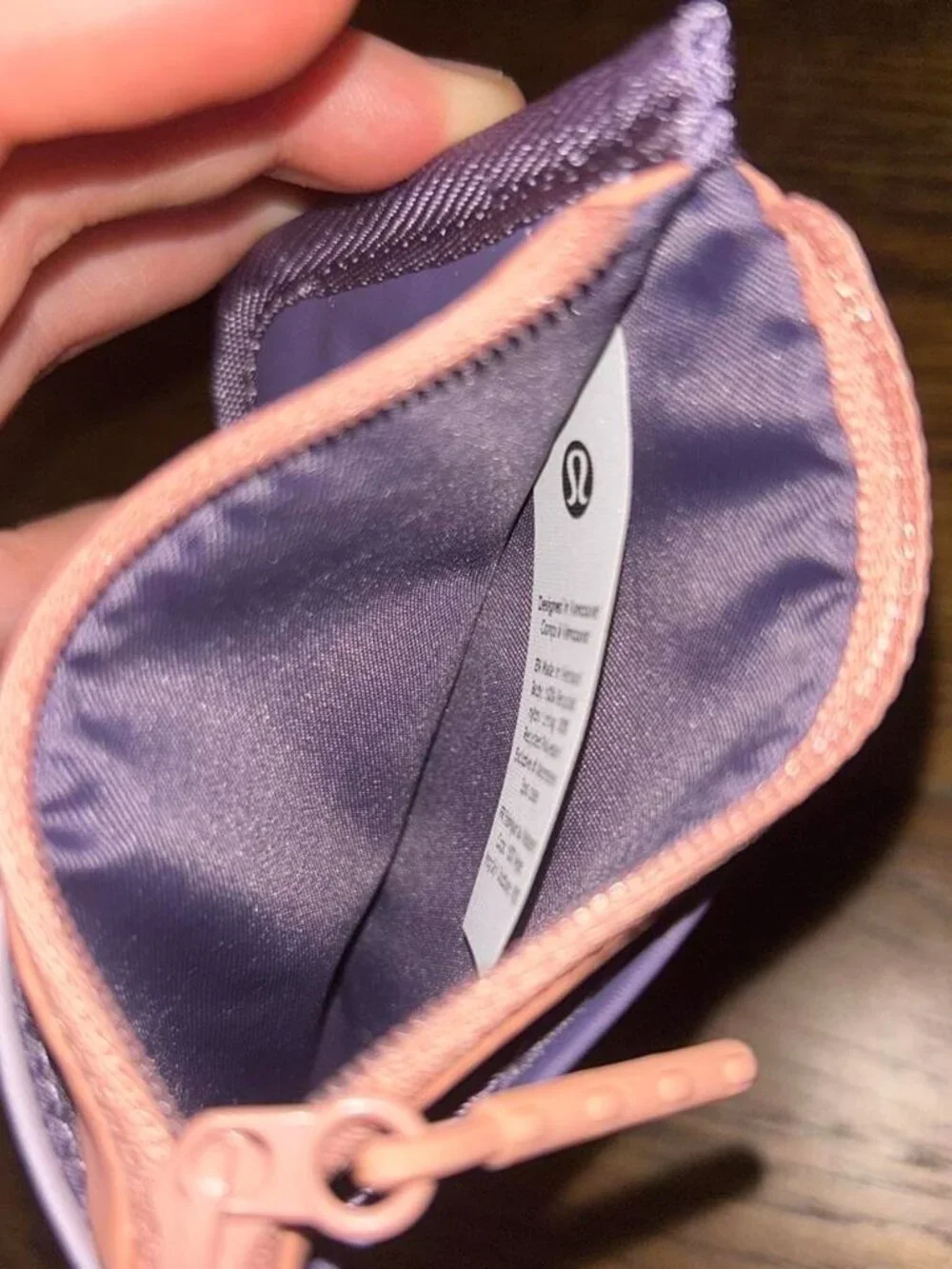 Lululemon purple, lavender, and peach zip up water-resistant cardholder